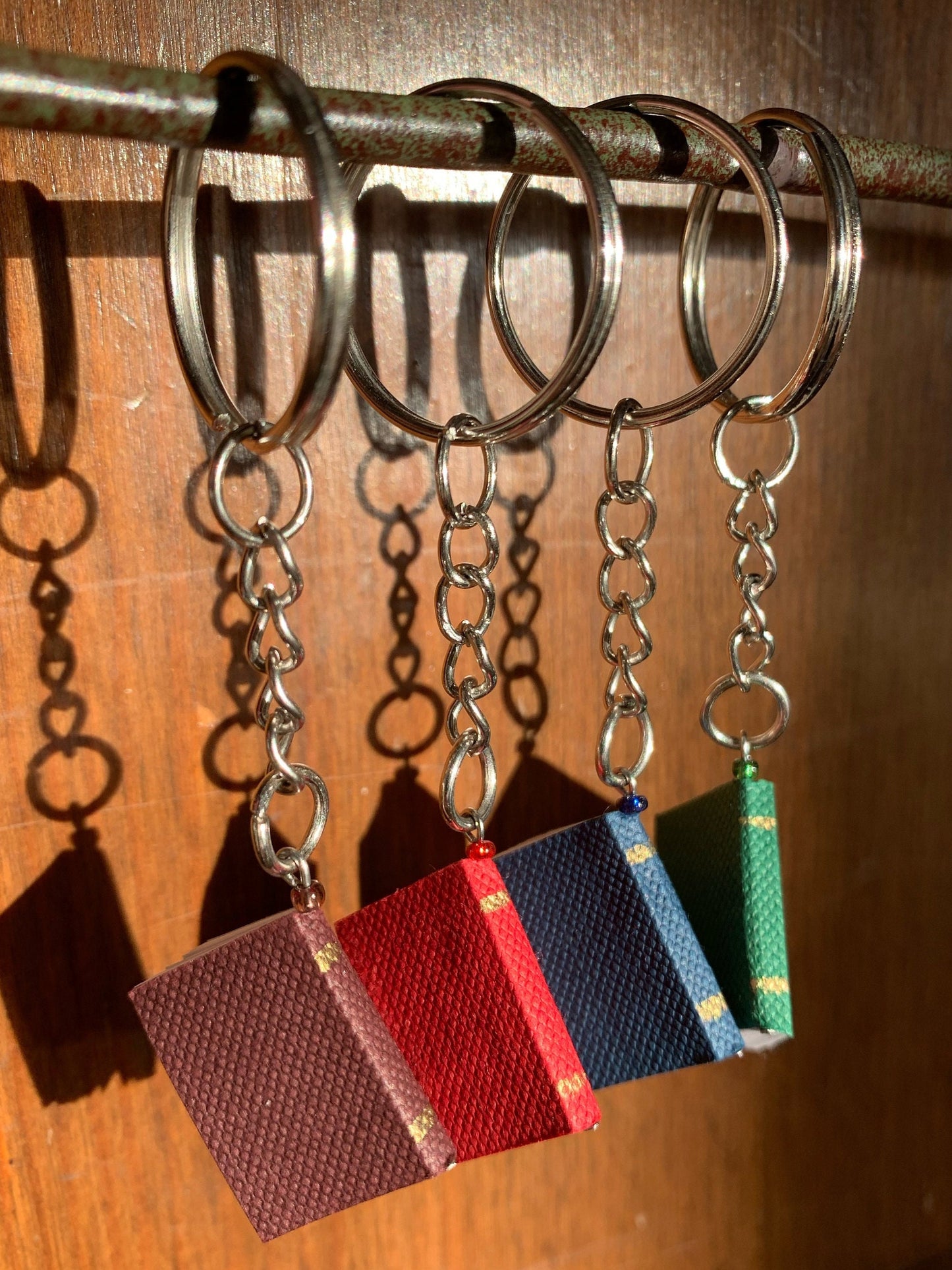 4 different colors of book keychains