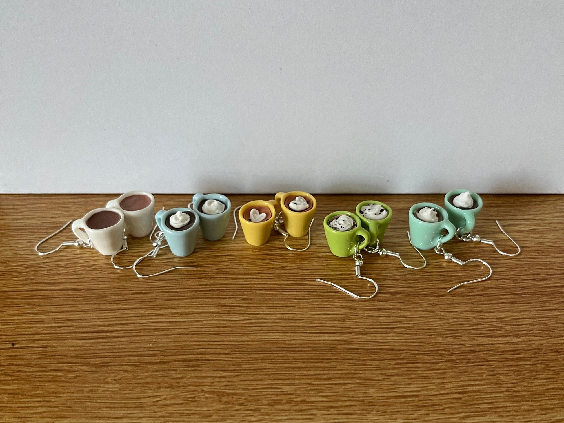 latte earrings win white, blue, yellow, green and teal mugs
