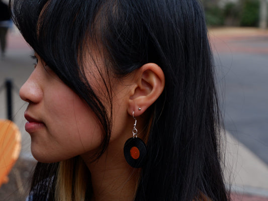 vinyl record earrings being worn